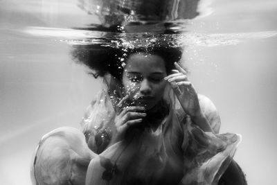 Portrait of young man swimming in sea