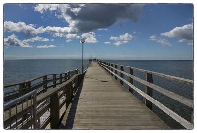 View of calm sea against cloudy sky