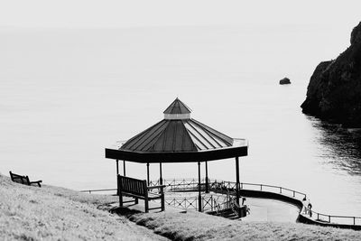 Lifeguard hut on beach against clear sky