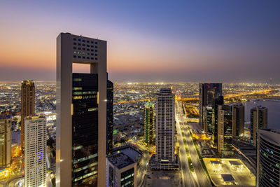 Illuminated buildings in city