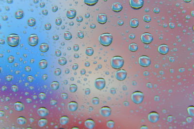 Full frame shot of wet glass window