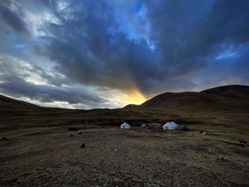 Scenic view of landscape against sky during sunset