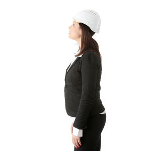 Side view of young woman against white background