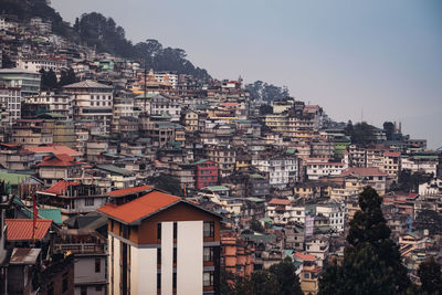 Houses in town against clear sky