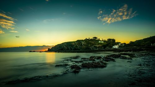 Scenic view of sea against sky during sunset