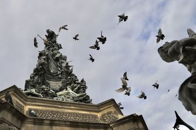 Low angle view of statue against sky