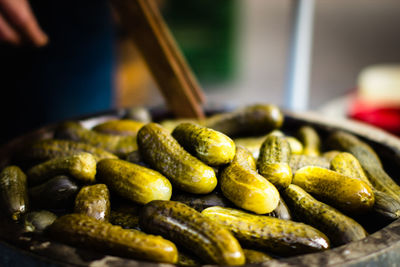 Close-up of pickled cucumbers in container