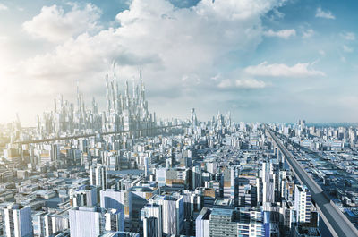 Aerial view of modern buildings in city against sky