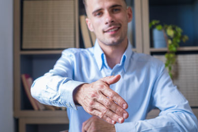 Portrait of senior man holding hands