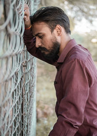 Side view of young man looking away