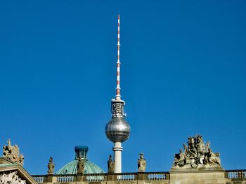 Low angle view of building against blue sky