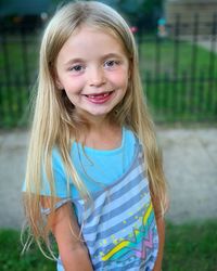 Portrait of smiling girl standing in park