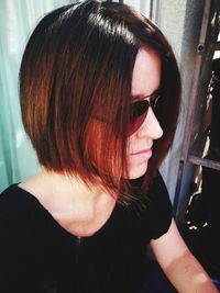 Close-up portrait of young woman wearing sunglasses