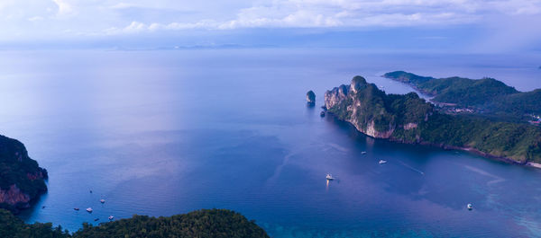 Aerial drone view of tropical ko phi phi island, and boats passenger in blue clear andaman sea 