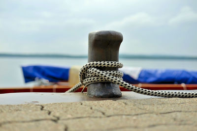 Close-up of rope on beach