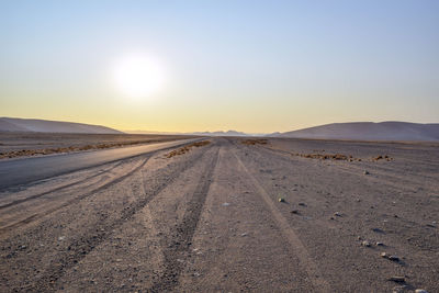 Scenic view of road against sky during sunset