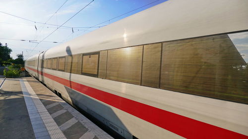 Train at railroad station platform against sky