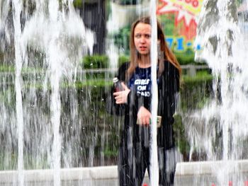 Portrait of young woman in water