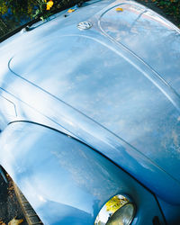 Close-up of car on road