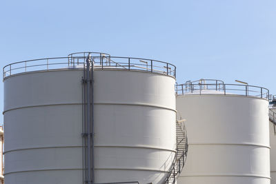 Low angle view of smoke stack against sky