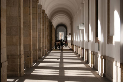 Corridor in building on sunny day