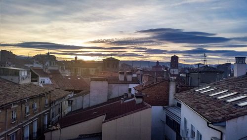 High angle view of houses against sky during sunset