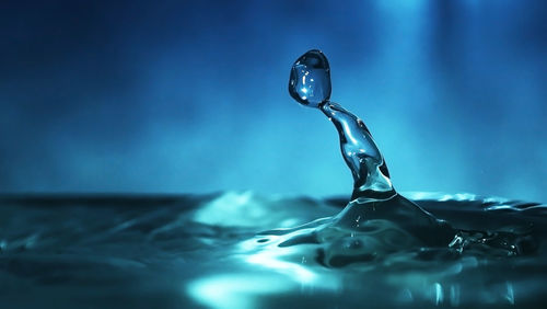 Close-up of drop on rippled water