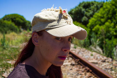 Portrait of young woman wearing hat