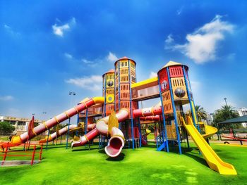 Low angle view of playground against sky