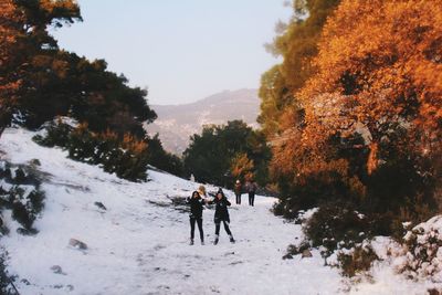 People on snow covered landscape