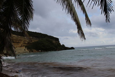 Scenic view of sea against cloudy sky