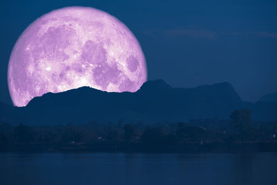 Close-up of purple water against lake at night