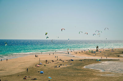Scenic view of beach against clear blue sky