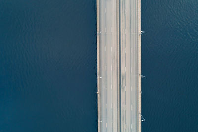 Drone shoot of high angle view of empty road across the river