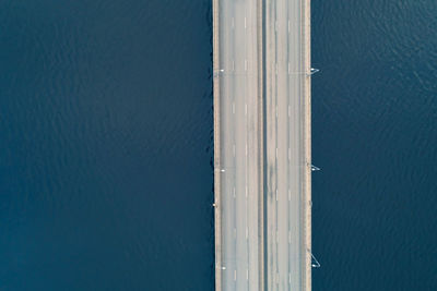 Drone shoot of high angle view of empty road across the river