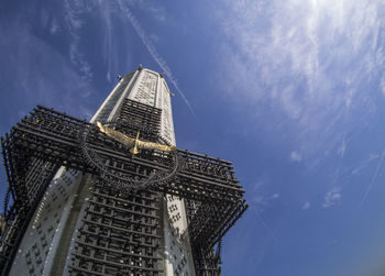 Low angle view of historical building against cloudy sky