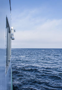 Sailboat in sea against sky