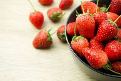 Close-up of strawberries in bowl on table