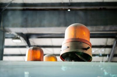 Low angle view of old emergency lights seen through train window