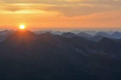 Scenic view of mountains against sky during sunset