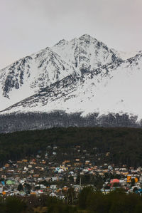 Aerial view of snowcapped mountains against sky
