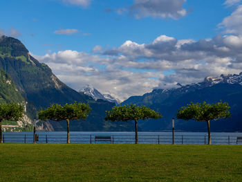 Scenic view of lake and mountains against sky