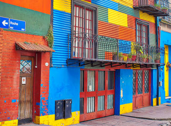 Multi colored residential building by street