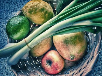 High angle view of fruits in basket on table