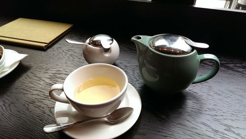 Close-up of coffee cup on table