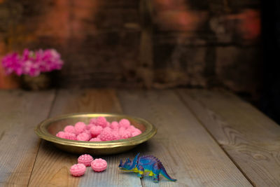 Close-up of pink roses on table