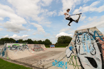 Full length of man skateboarding against sky