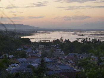 High angle view of townscape against sky during sunset