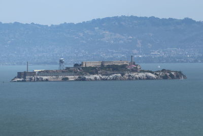 Scenic view of sea and buildings against sky  alcatraz 