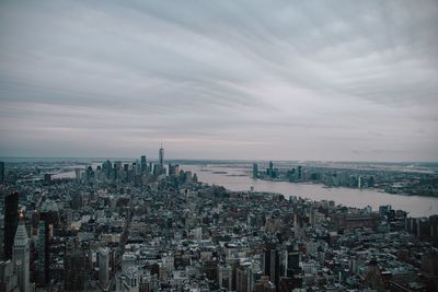 High angle view of city buildings against sky